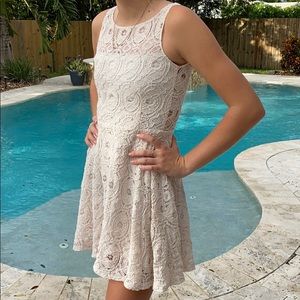 Off white lace mini dress with zipper in the back.